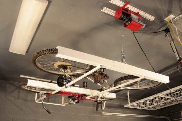 How to Free Up Space In Your Garage By Using Overhead Storage