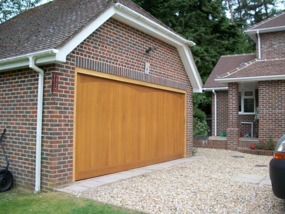 SOLID CEDAR TIMBER GARAGE DOOR FITTED IN LEATHERHEAD, SURREY 1