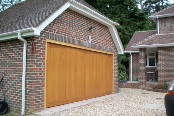 SOLID CEDAR TIMBER GARAGE DOOR FITTED IN LEATHERHEAD, SURREY