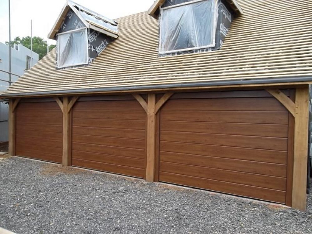 3 CARTECK SECTIONAL DOORS IN DARK OAK FITTED CHILWORTH, SURREY 1