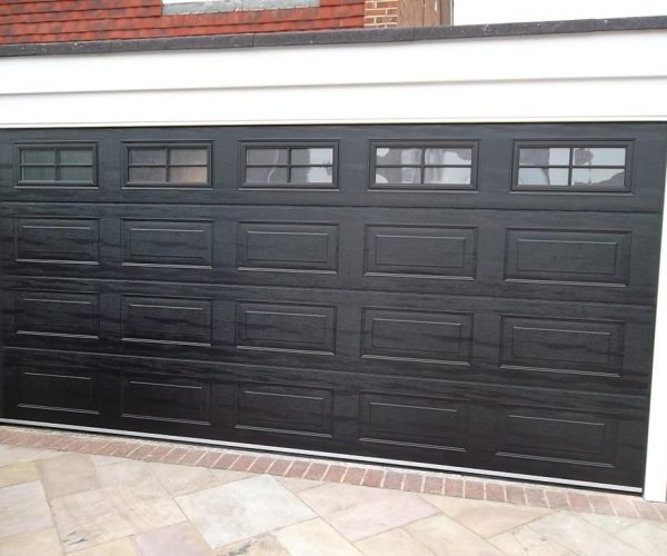 CARTECK SECTIONAL GARAGE DOOR WITH WINDOWS FITTED IN HASLEMERE 2