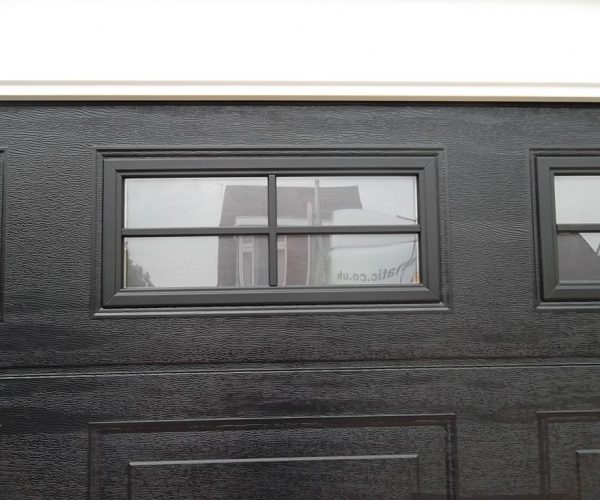 CARTECK SECTIONAL GARAGE DOOR WITH WINDOWS FITTED IN HASLEMERE 4