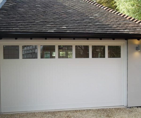 CEDAR TIMBER GARAGE DOOR WITH WINDOWS FITTED IN GUILDFORD 2