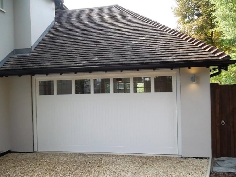 CEDAR TIMBER GARAGE DOOR WITH WINDOWS FITTED IN GUILDFORD 1