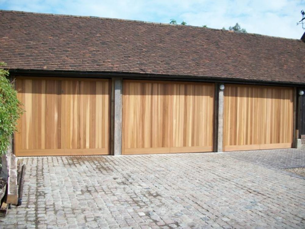 3 TIMBER CEDAR GARAGE DOORS FITTED HINDHEAD, HAMPSHIRE 1