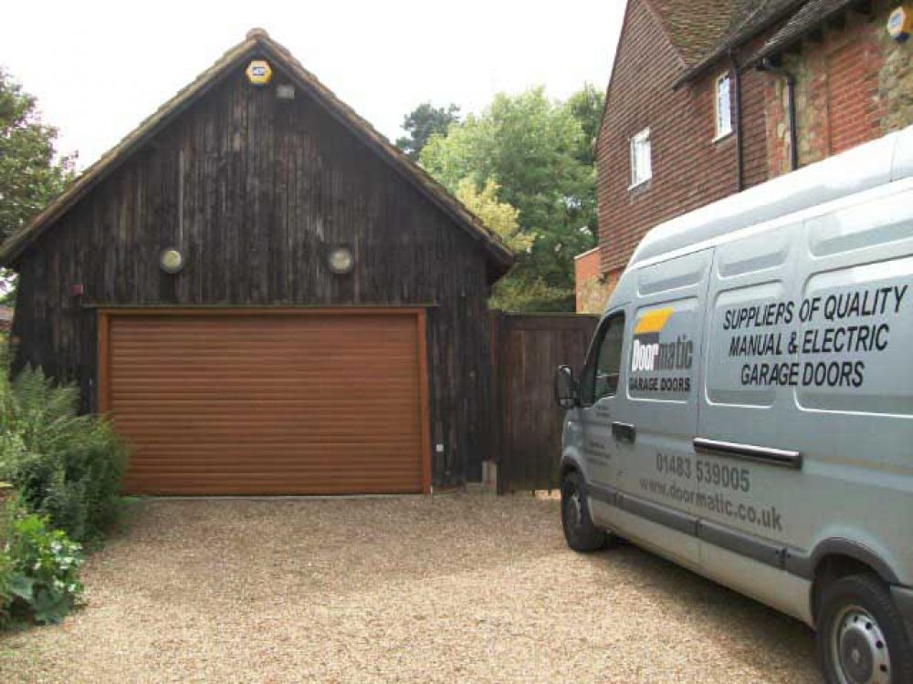 SECEUROGLIDE ROLLER DOOR IN GOLDEN OAK, DORKING SURREY 1
