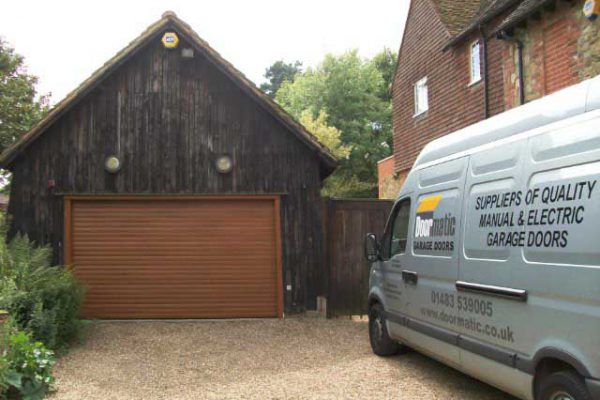 SECEUROGLIDE ROLLER DOOR IN GOLDEN OAK, DORKING SURREY