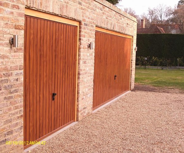 CARDALE STEEL GARAGE DOORS FINISHED IN GOLDEN OAK, COBHAM 2