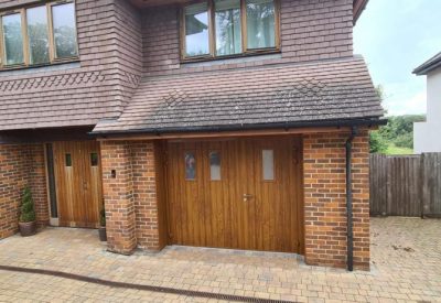 Garage door with pedestrian access