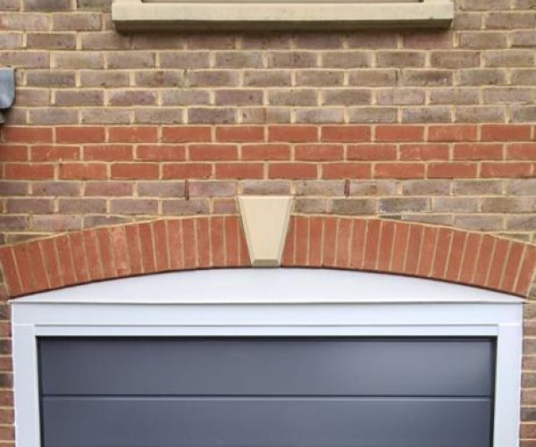 Blue Sectional Garage Door with matching front door 5