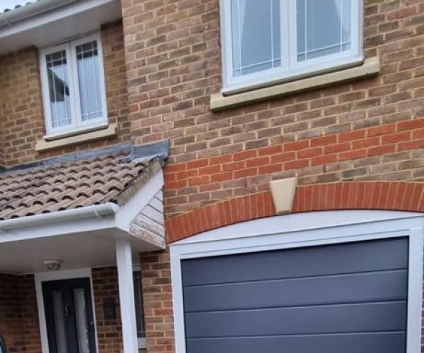 Blue Sectional Garage Door with matching front door 2