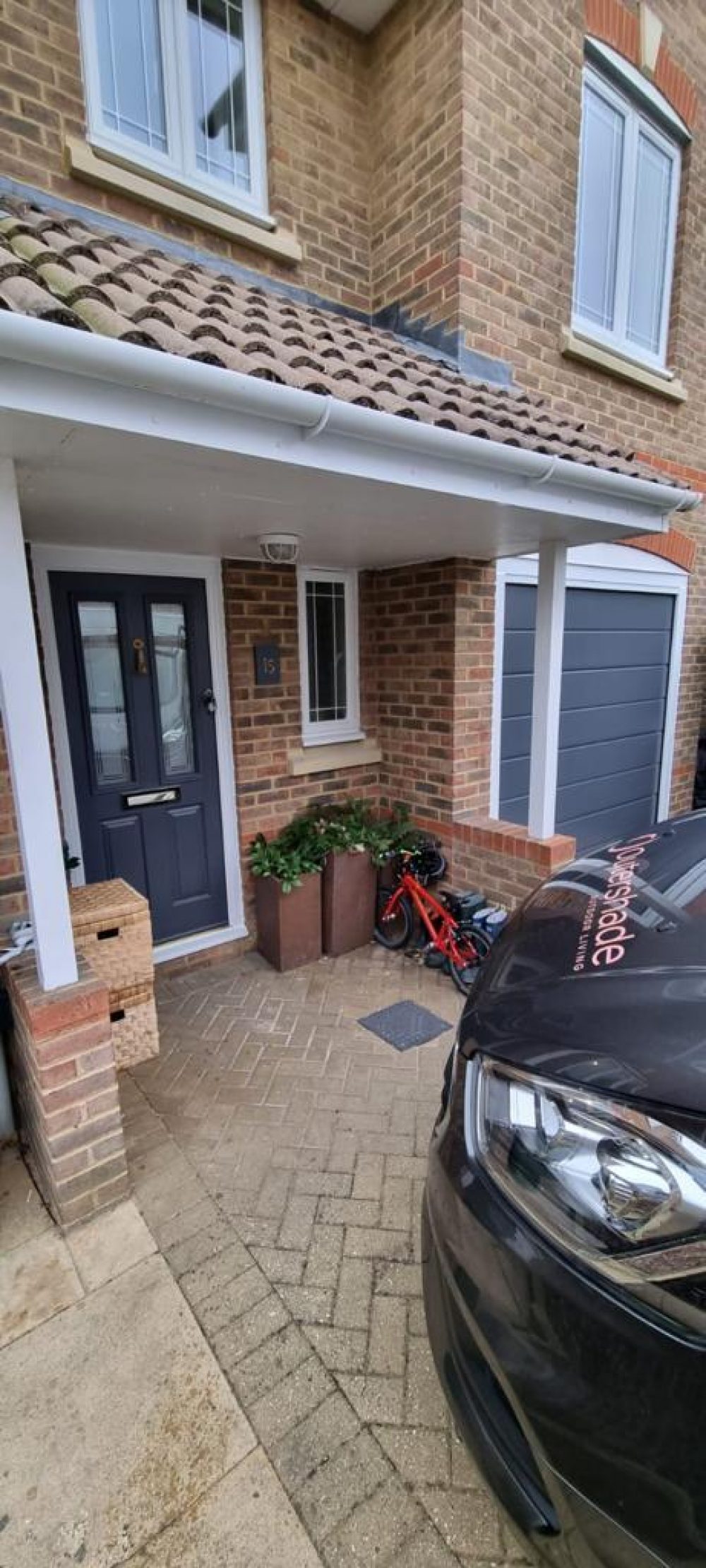 Blue Sectional Garage Door with matching front door 1