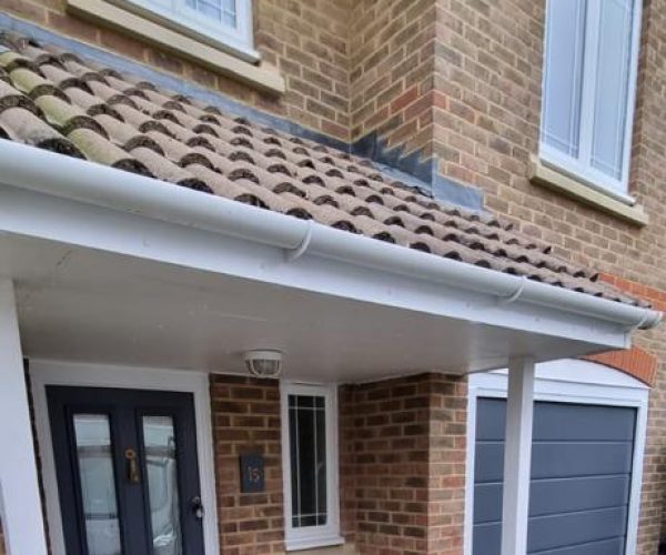 Blue Sectional Garage Door with matching front door 3