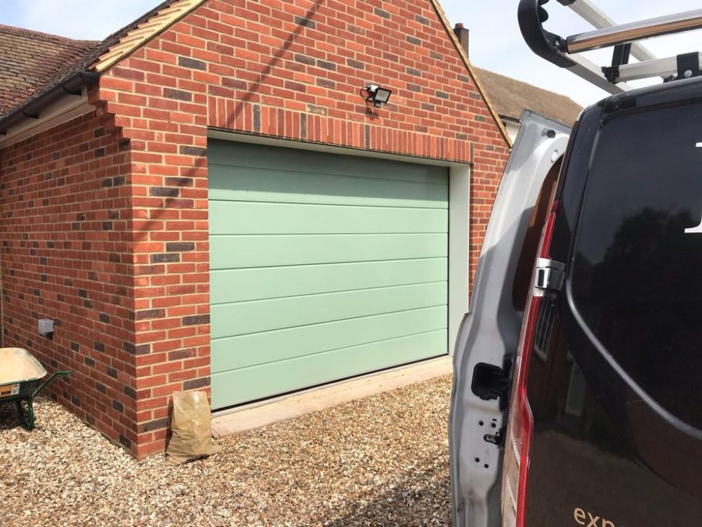 Sage Coloured Sectional Garage Door 1