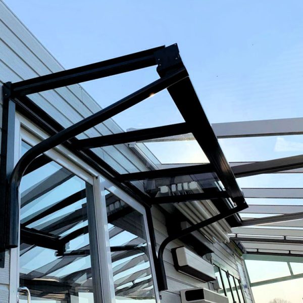 Glass entrance canopy installation on property in Surrey