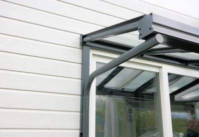 Glass over door canopy