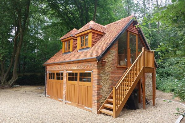 Pair of wooden Side-hinged doors installed to detached garage