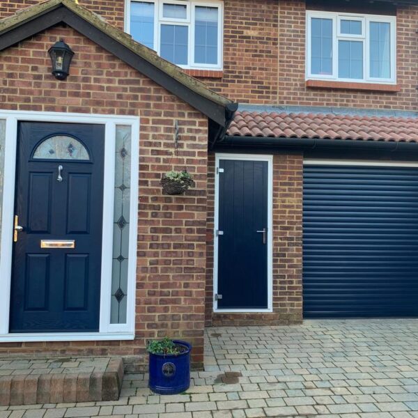 Matching garage door, side door and front door in navy blue