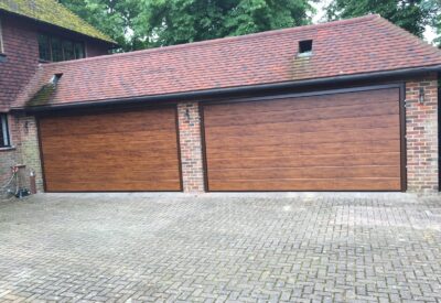 Double garage doors in oak - Doormatic Garage Doors