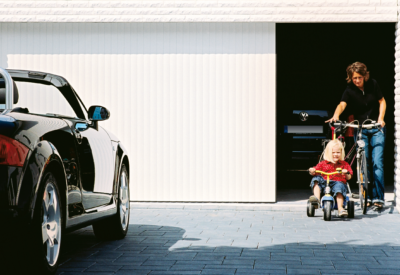 Vertico sliding garage door with parent and child - Doormatic