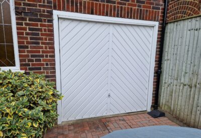 Front view of a white garage door installed by Doormatic