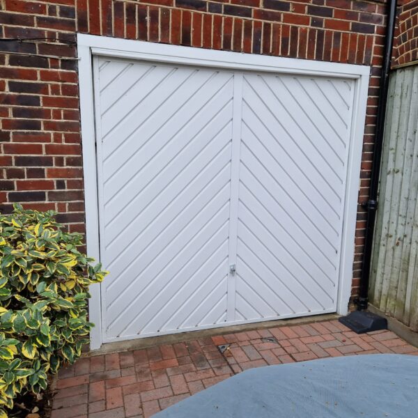 Front view of a white garage door installed by Doormatic